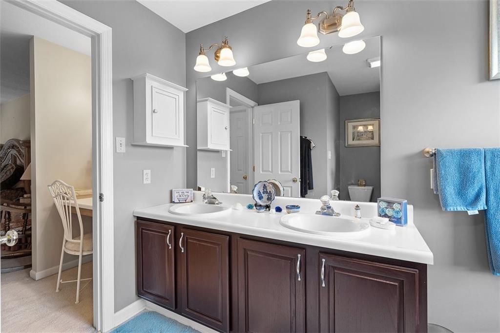 247 Randy Lane Coraopolis, PA 15108 - Photo 27 of 39 a bathroom with a sink double vanity and a mirror
