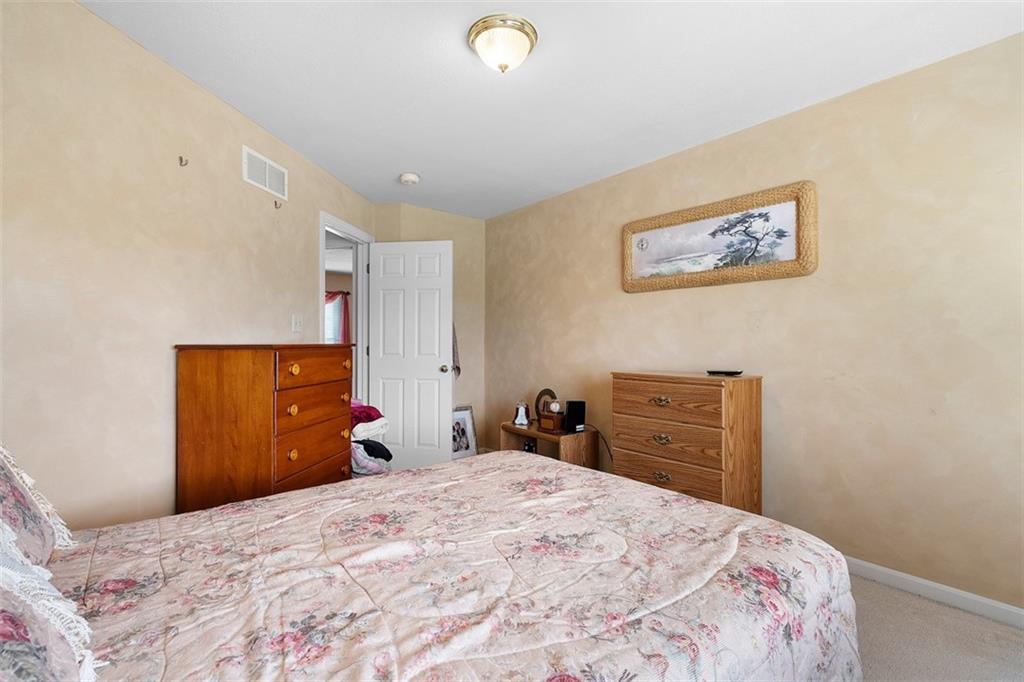 247 Randy Lane Coraopolis, PA 15108 - Photo 30 of 39 a bedroom with a bed and a dresser