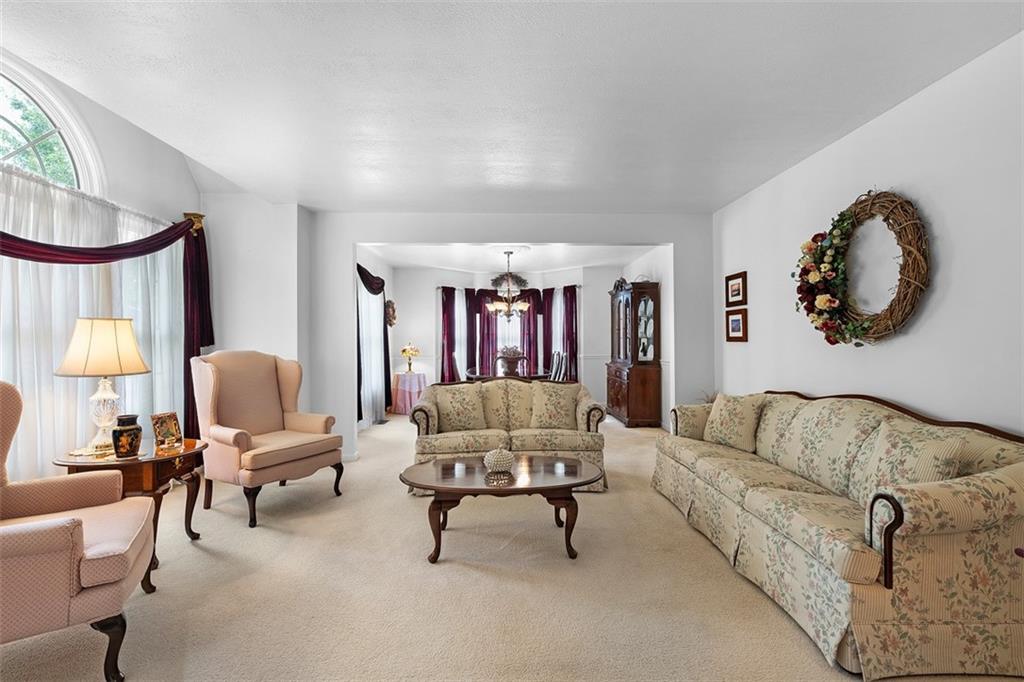 247 Randy Lane Coraopolis, PA 15108 - Photo 8 of 39 a living room with furniture and a large window