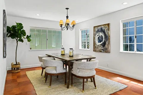 a kitchen with stainless steel appliances a refrigerator sink and cabinets