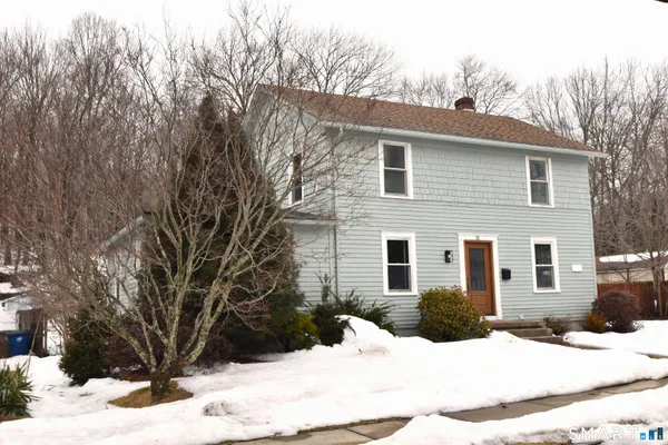a view of a house covered in snow