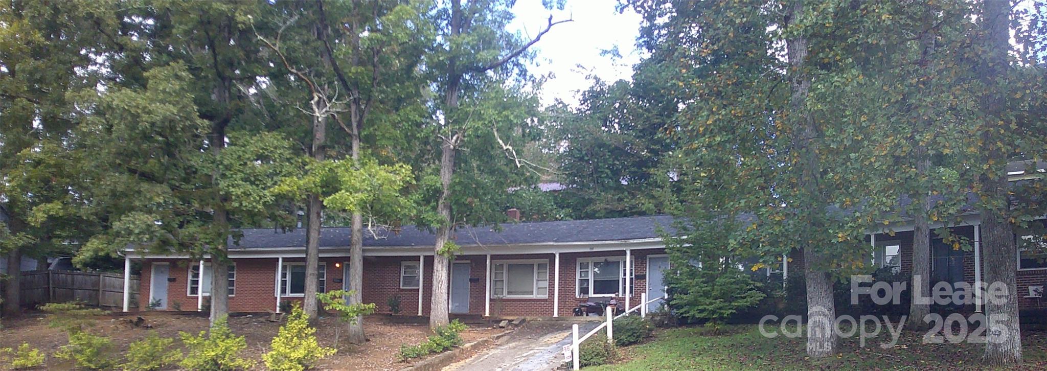 435 Arlington Circle Northwest, Unit E Lenoir, NC 28645 - Photo 2 of 7 front view of house with a tree
