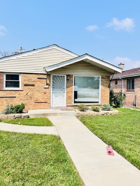 9508 South Green Street Chicago, IL 60643 - Photo 2 of 47 a front view of a house with a yard