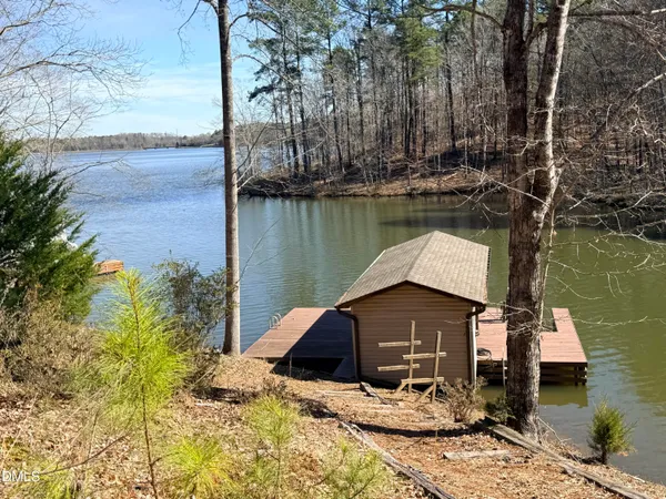 a backyard of a house with a yard and outdoor seating