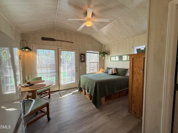 a bedroom with a bed and a table