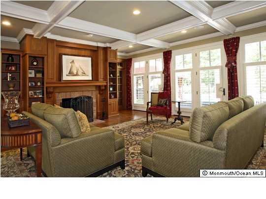15 Heathcliff Road Rumson, NJ 07760 - Photo 5 of 22 a living room with furniture a flat screen tv and a fireplace