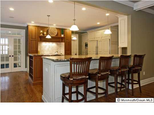 15 Heathcliff Road Rumson, NJ 07760 - Photo 9 of 22 a kitchen with granite countertop a table and chairs