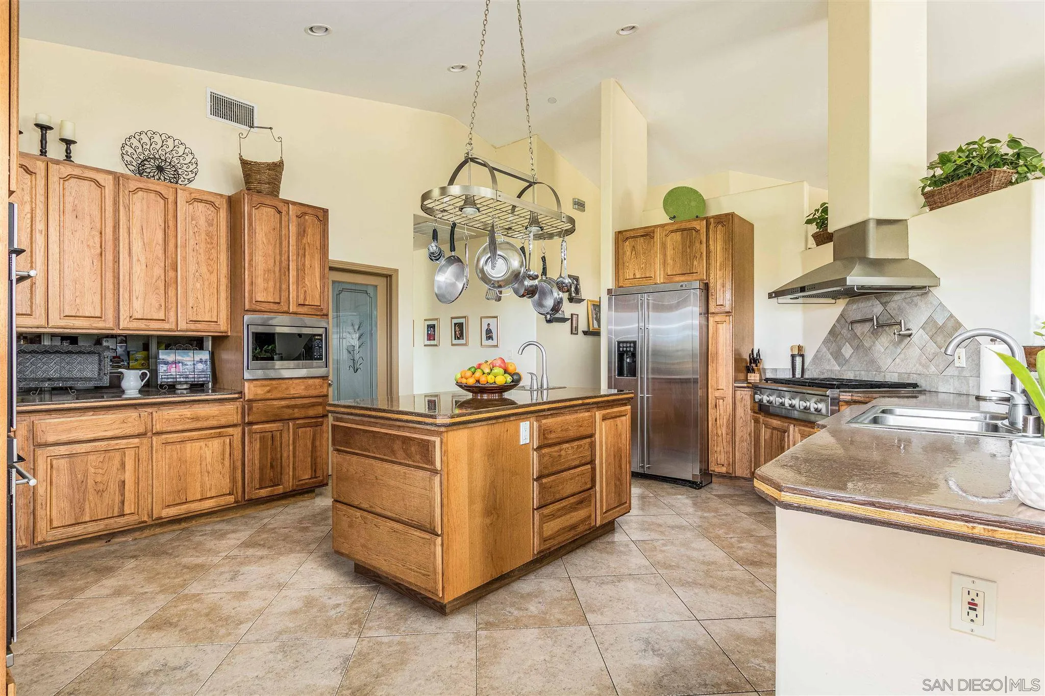 29482 Paso Robles Road Valley Center, CA 92082 - Photo 14 of 37 a kitchen with stainless steel appliances granite countertop a sink and cabinets