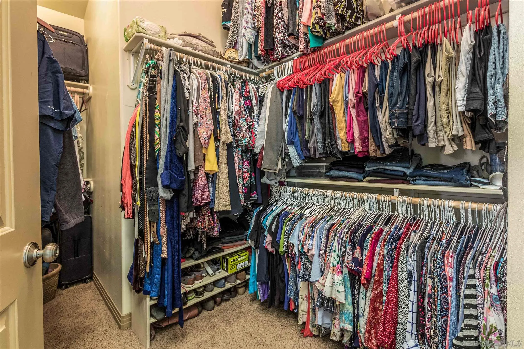 29482 Paso Robles Road Valley Center, CA 92082 - Photo 23 of 37 a view of walk in closet with clothes