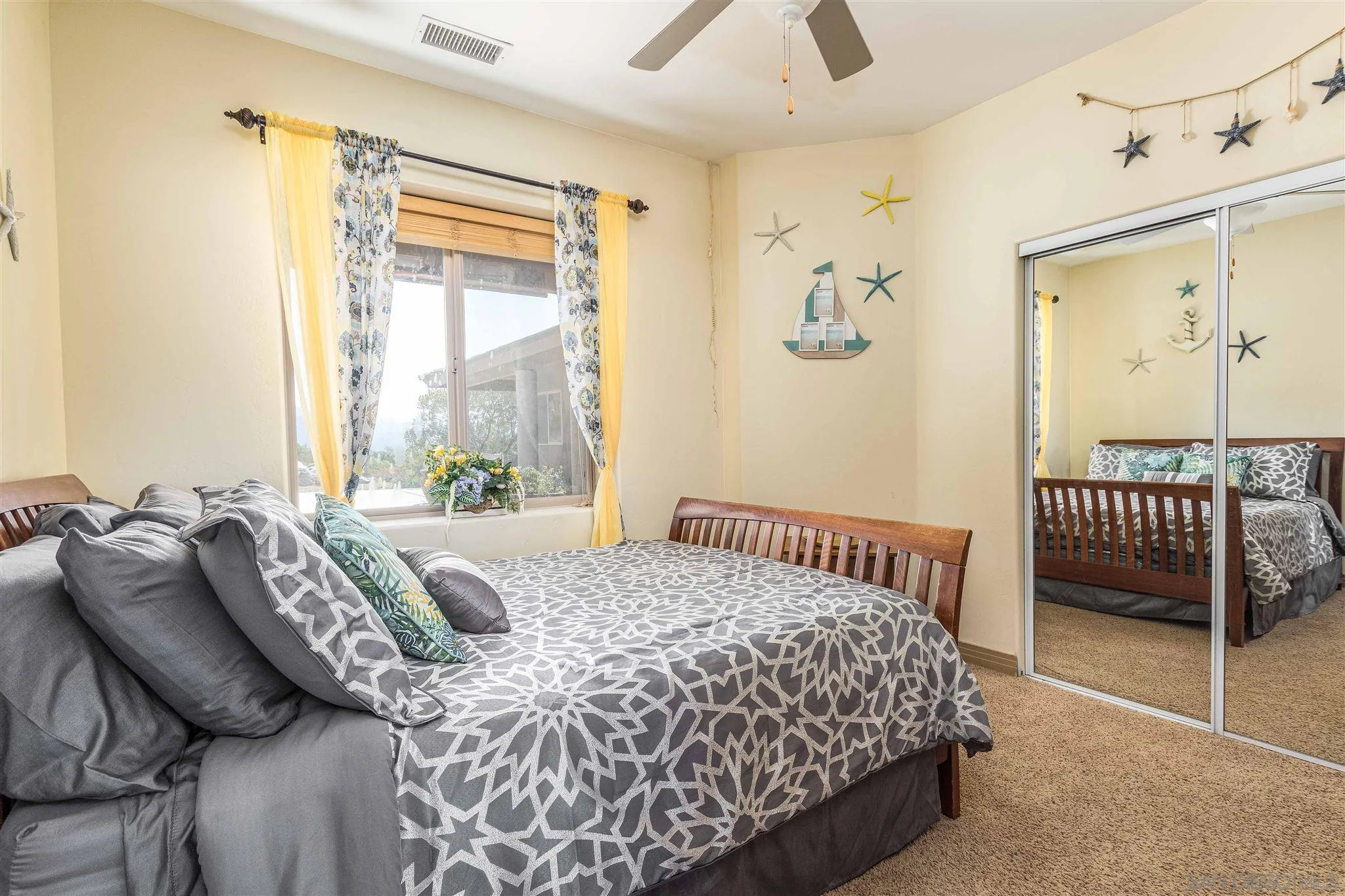 29482 Paso Robles Road Valley Center, CA 92082 - Photo 28 of 37 a bedroom with a bed and a window