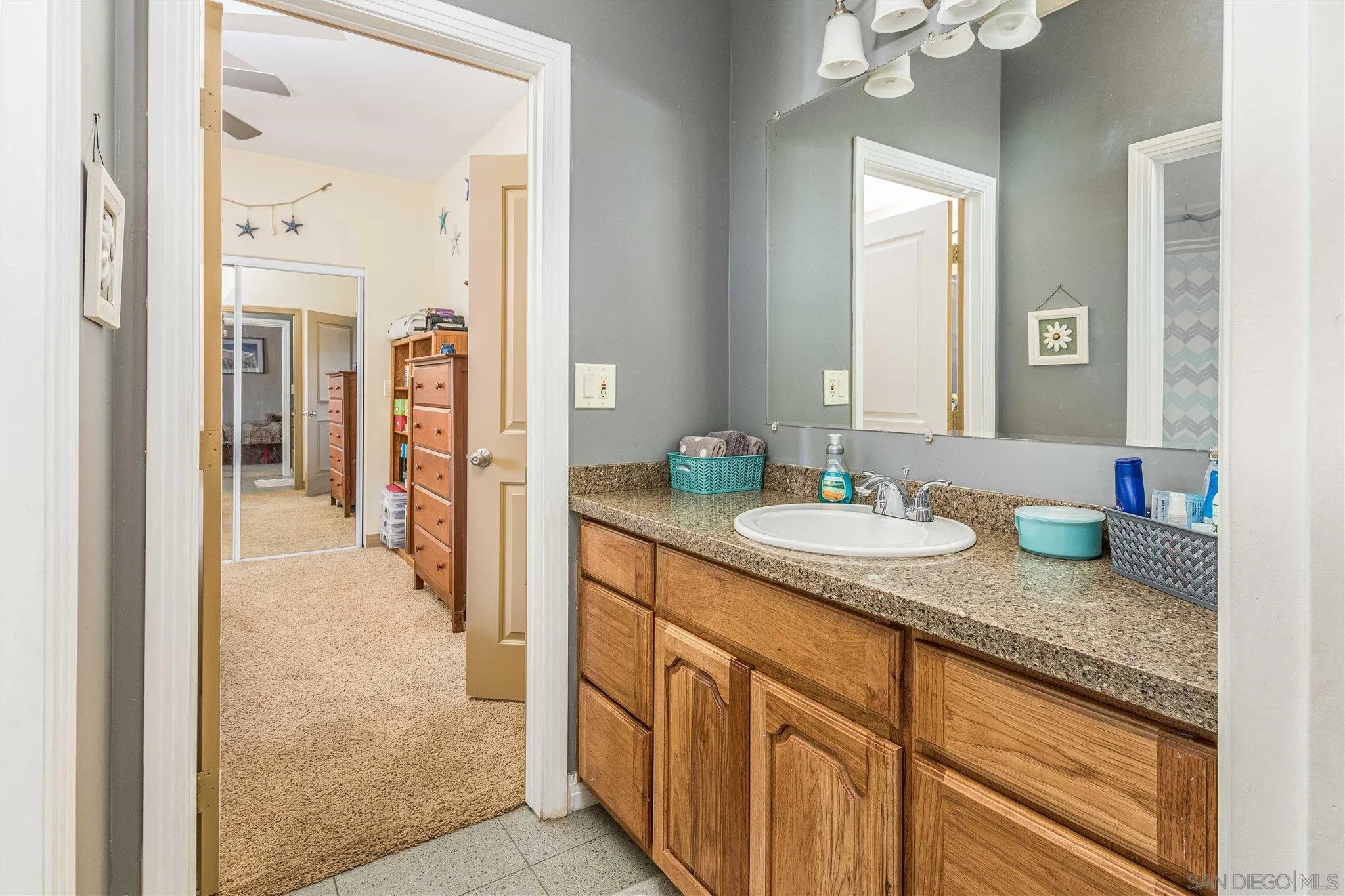 29482 Paso Robles Road Valley Center, CA 92082 - Photo 31 of 37 a bathroom with sinks granite countertop a sink and a mirror