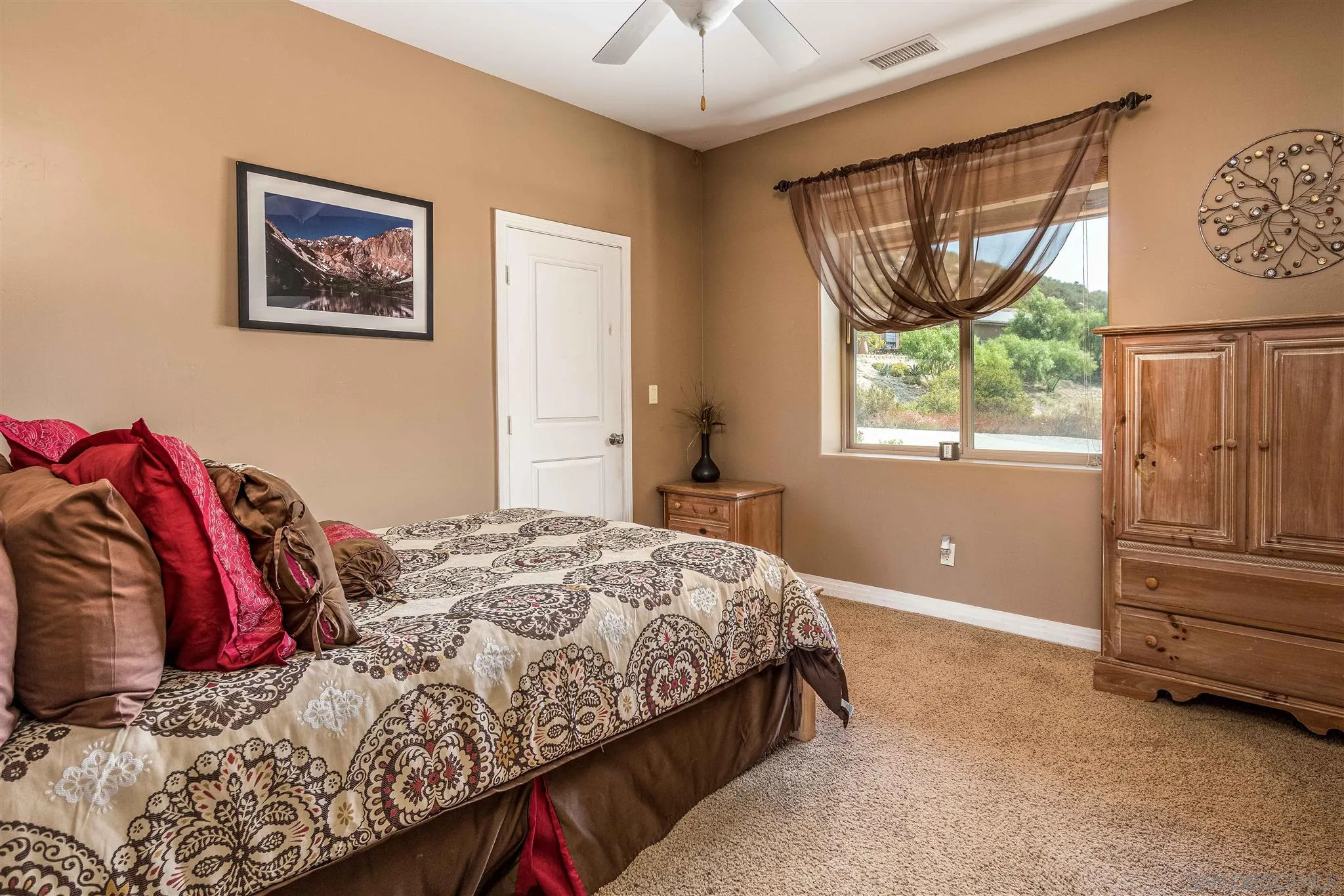 29482 Paso Robles Road Valley Center, CA 92082 - Photo 32 of 37 a bedroom with a bed and a window