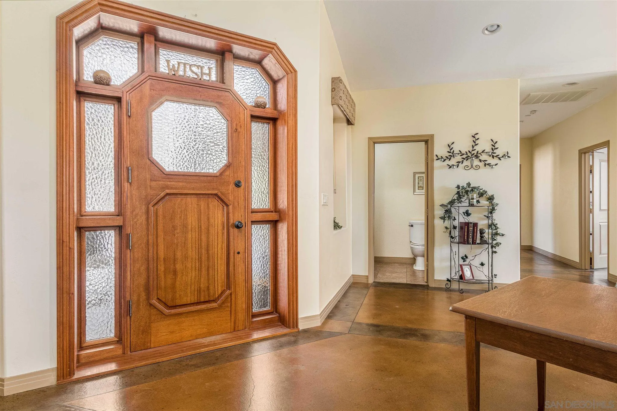 29482 Paso Robles Road Valley Center, CA 92082 - Photo 4 of 37 an entryway with wooden floor mirror