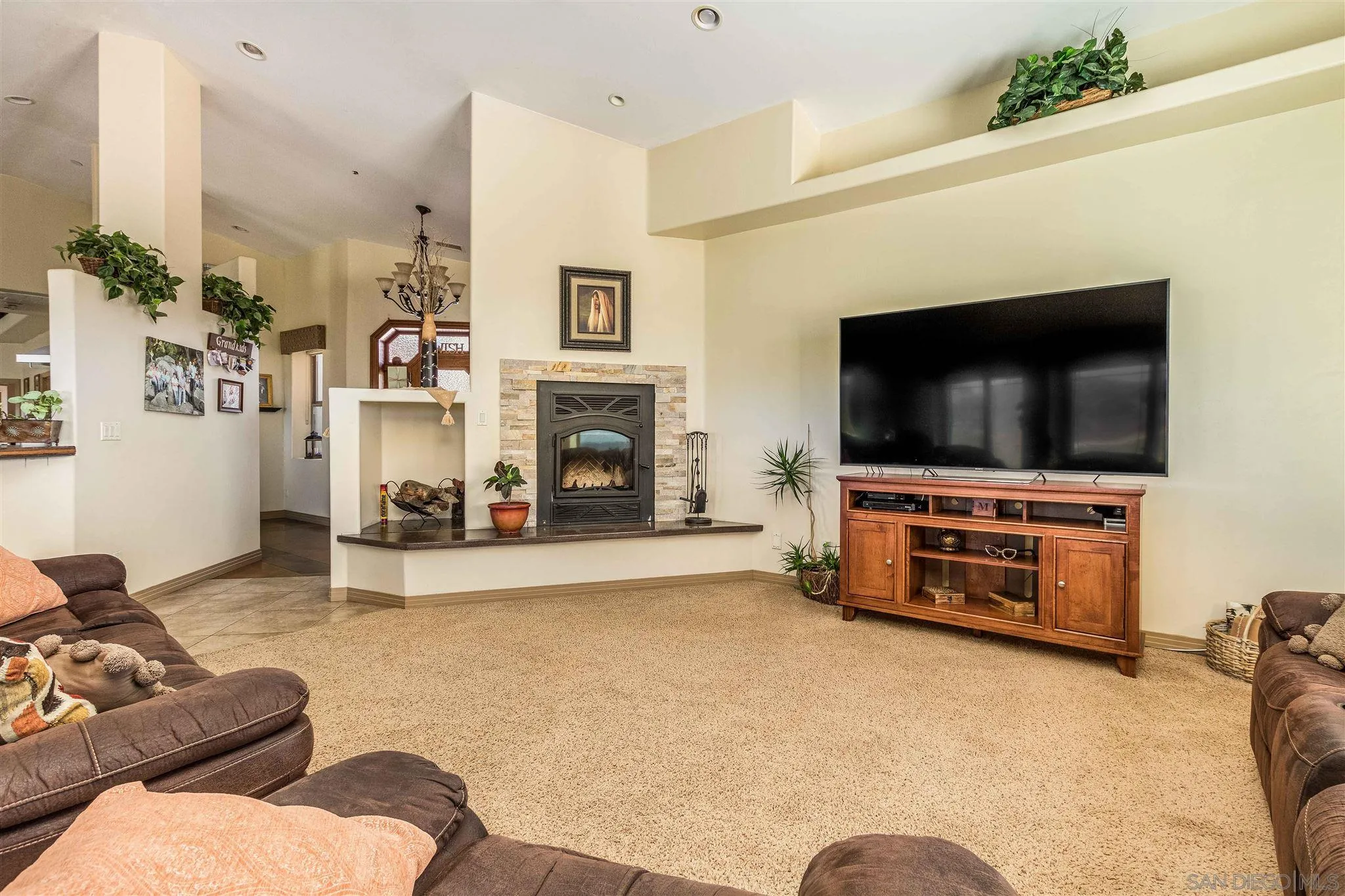 29482 Paso Robles Road Valley Center, CA 92082 - Photo 7 of 37 a living room with furniture and a flat screen tv