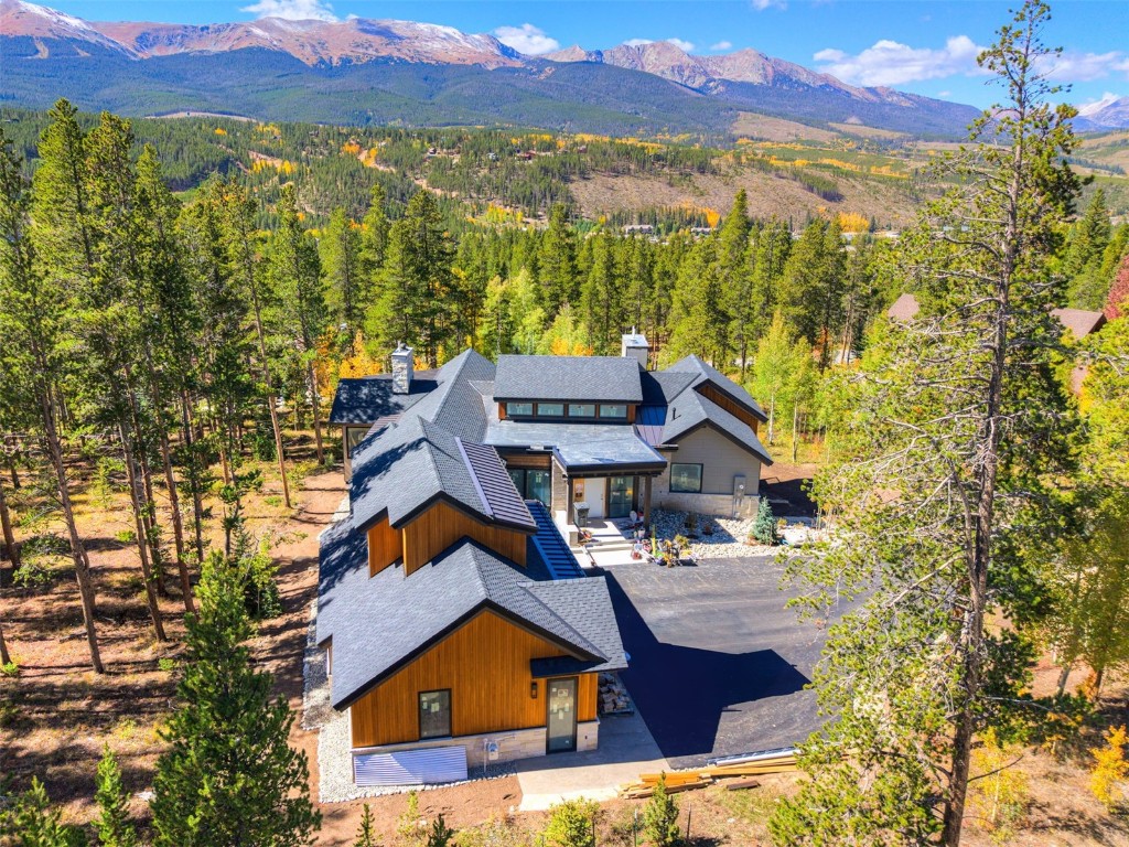 9 Rounds Road Breckenridge, CO 80424 - Photo 12 of 15 Aerial view of property and surrounding area with a mountain backdrop and a heavily wooded area