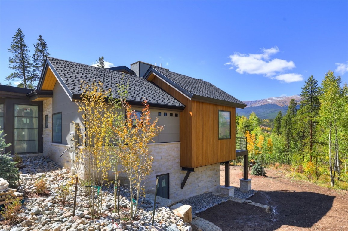 9 Rounds Road Breckenridge, CO 80424 - Photo 14 of 15 View of side of property with stone siding and roof with shingles