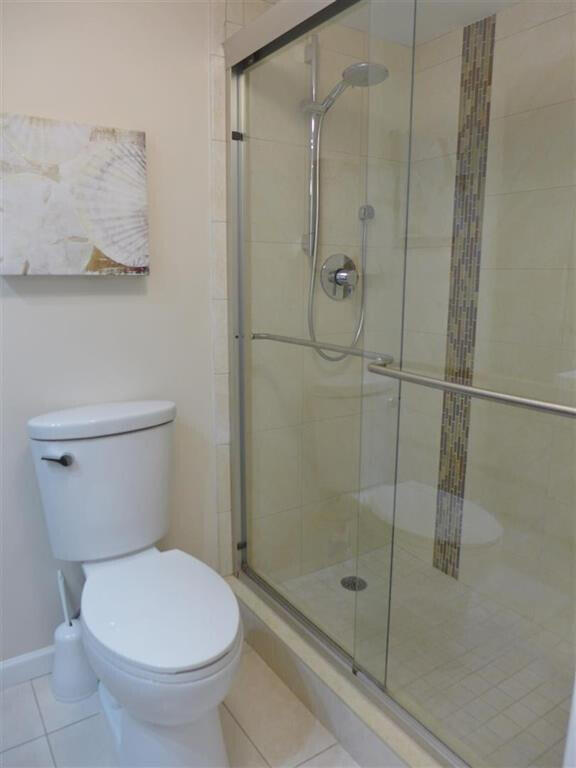 605 Oaks Drive, Unit 503 Pompano Beach, FL 33069 - Photo 13 of 15 a bathroom with a toilet and a shower