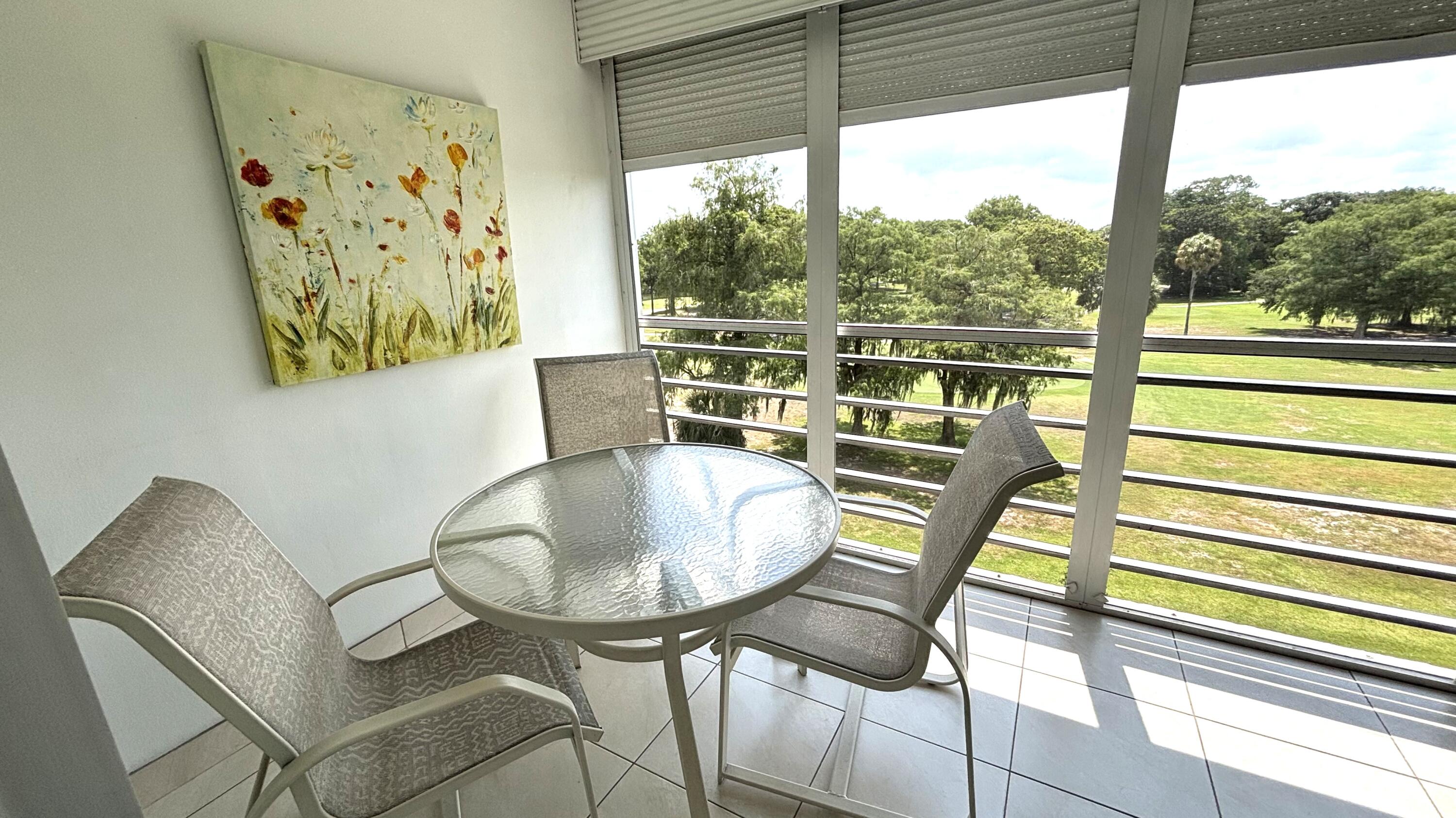 605 Oaks Drive, Unit 503 Pompano Beach, FL 33069 - Photo 15 of 15 a view of a dining room with furniture window and outside view