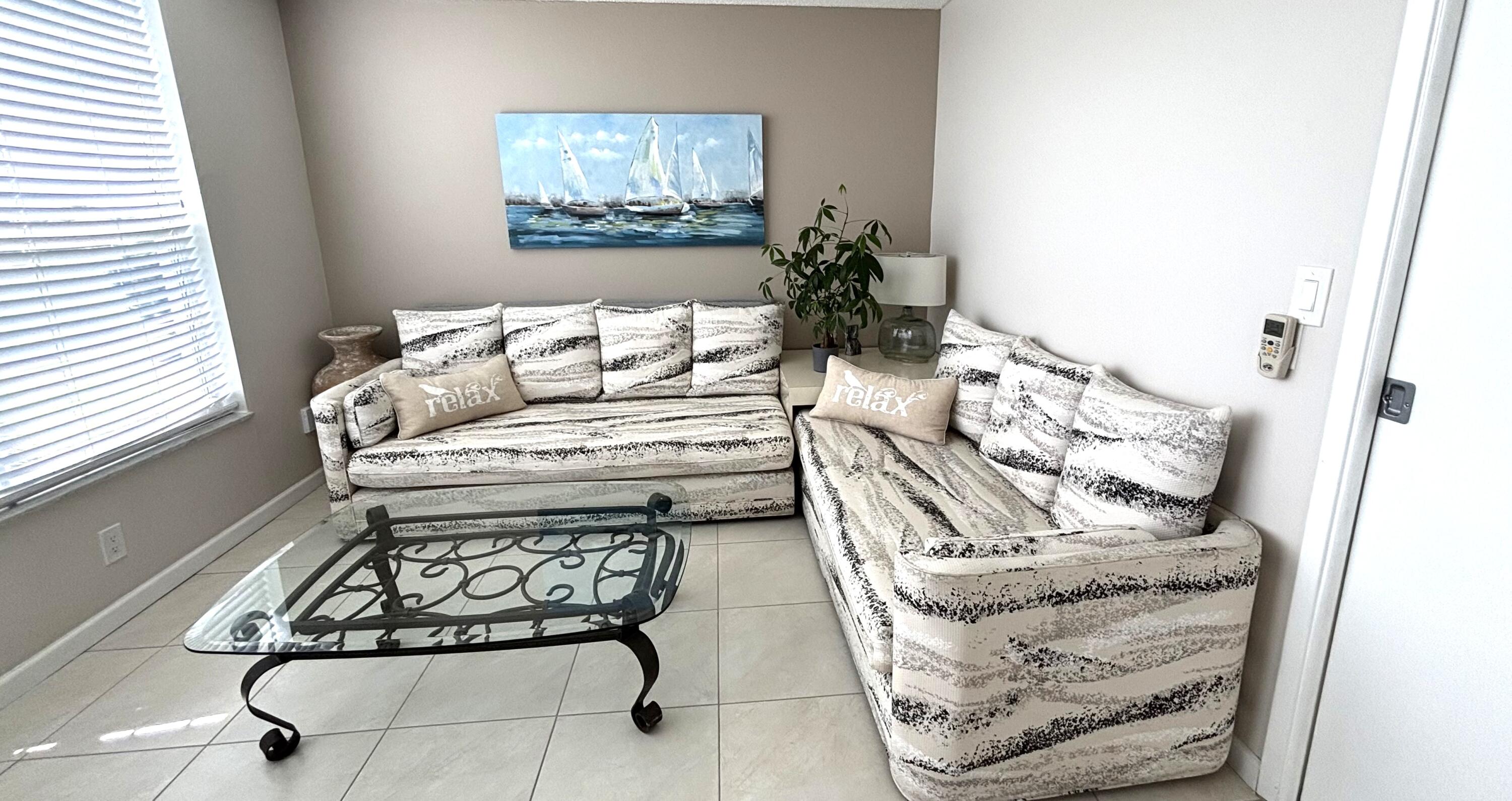 605 Oaks Drive, Unit 503 Pompano Beach, FL 33069 - Photo 7 of 15 a living room with furniture and a potted plant
