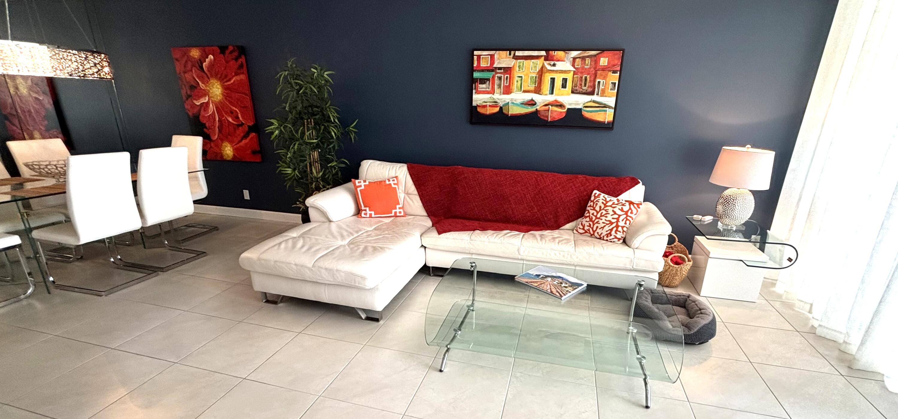 605 Oaks Drive, Unit 503 Pompano Beach, FL 33069 - Photo 9 of 15 a living room with furniture and a flat screen tv