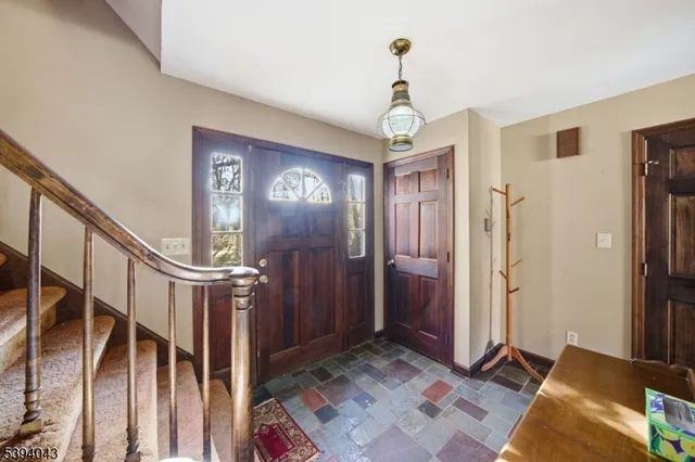 a bed room with a bed and a chair