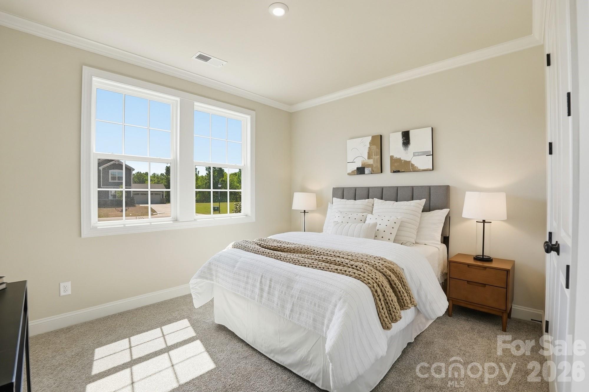 2608 Mabel Lane Monroe, NC 28110 - Photo 17 of 36 a bedroom with a bed and a window