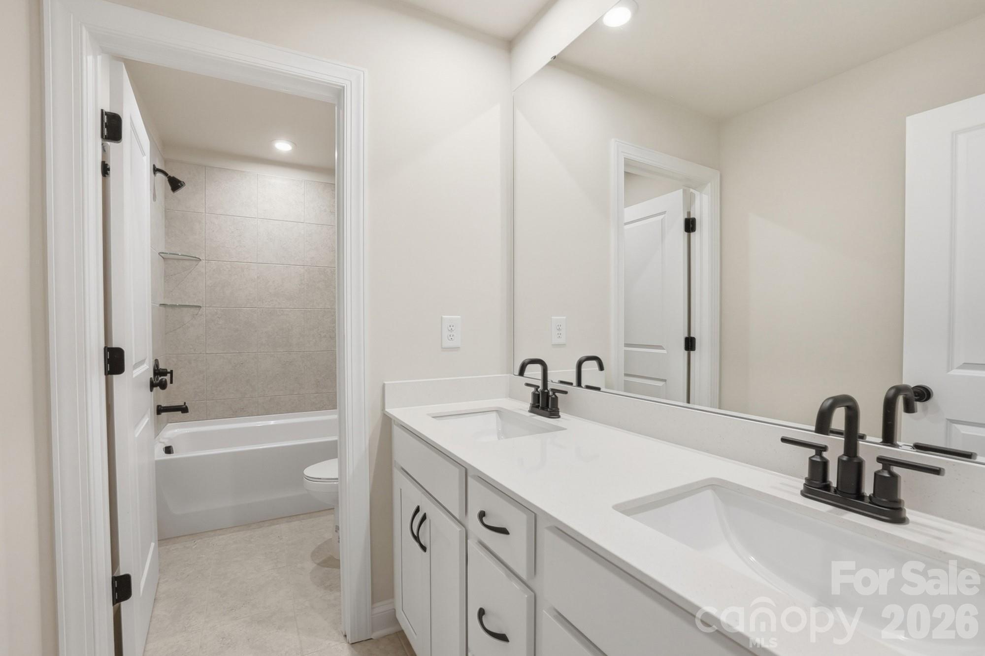 2608 Mabel Lane Monroe, NC 28110 - Photo 23 of 36 a bathroom with a sink and a mirror