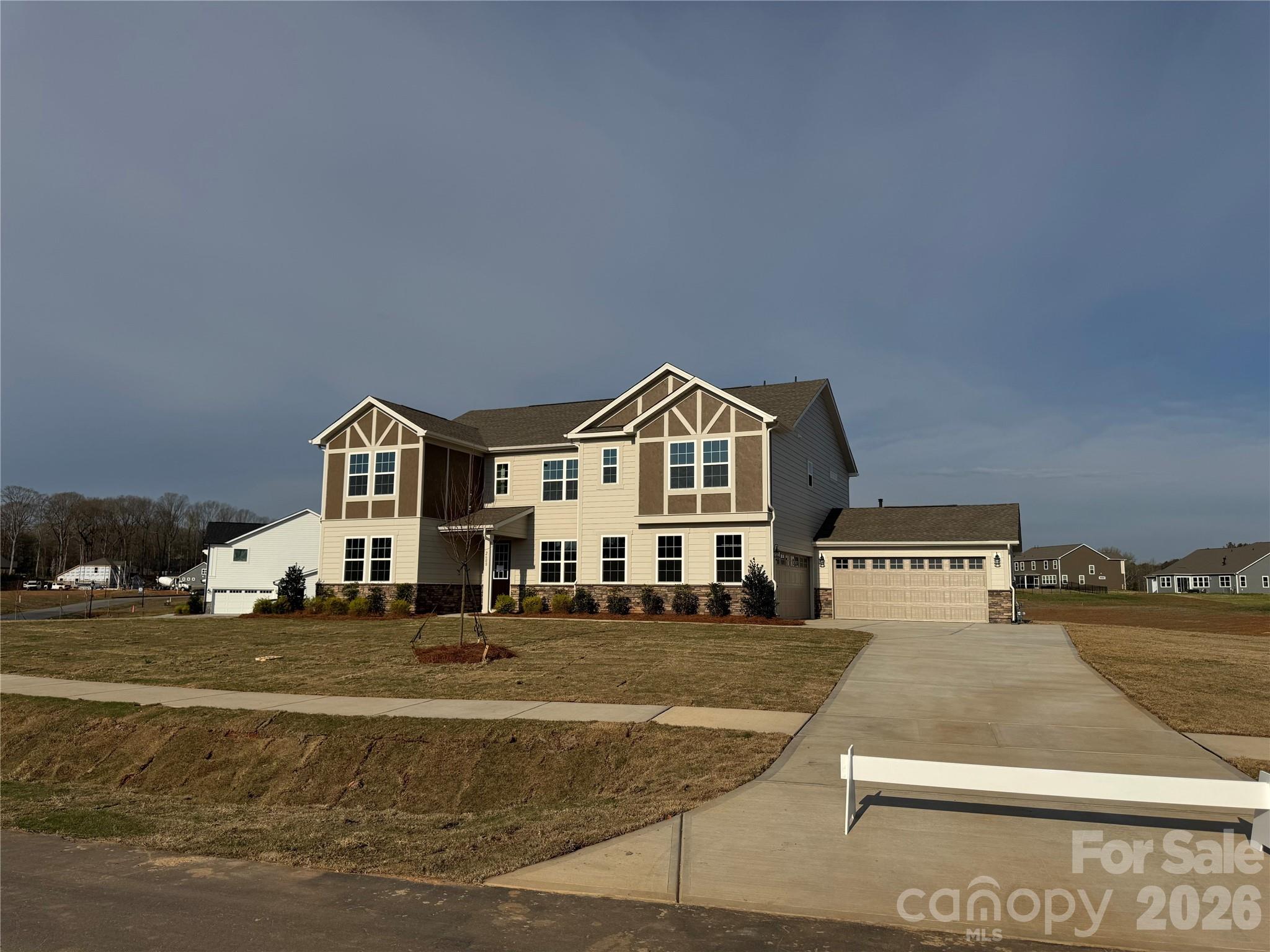 2608 Mabel Lane Monroe, NC 28110 - Photo 3 of 36 a view of a white house with a yard