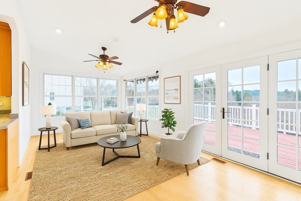 45 Endean Drive Walpole, MA 02032 - Photo 14 of 42 a living room with furniture and a floor to ceiling window