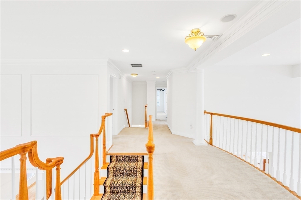 45 Endean Drive Walpole, MA 02032 - Photo 17 of 42 a living room with furniture and a chandelier
