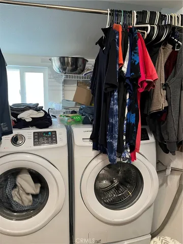 a utility room with sink dryer and washer