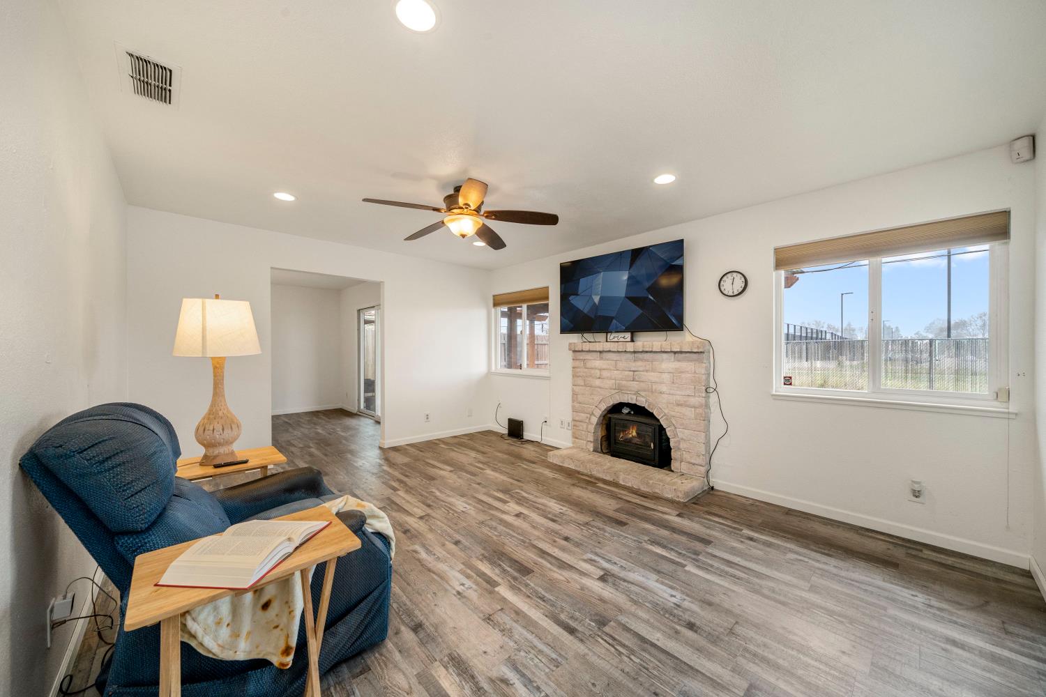 7358 Candlelight Way Citrus Heights, CA 95621 - Photo 12 of 45 a living room with furniture and a fireplace