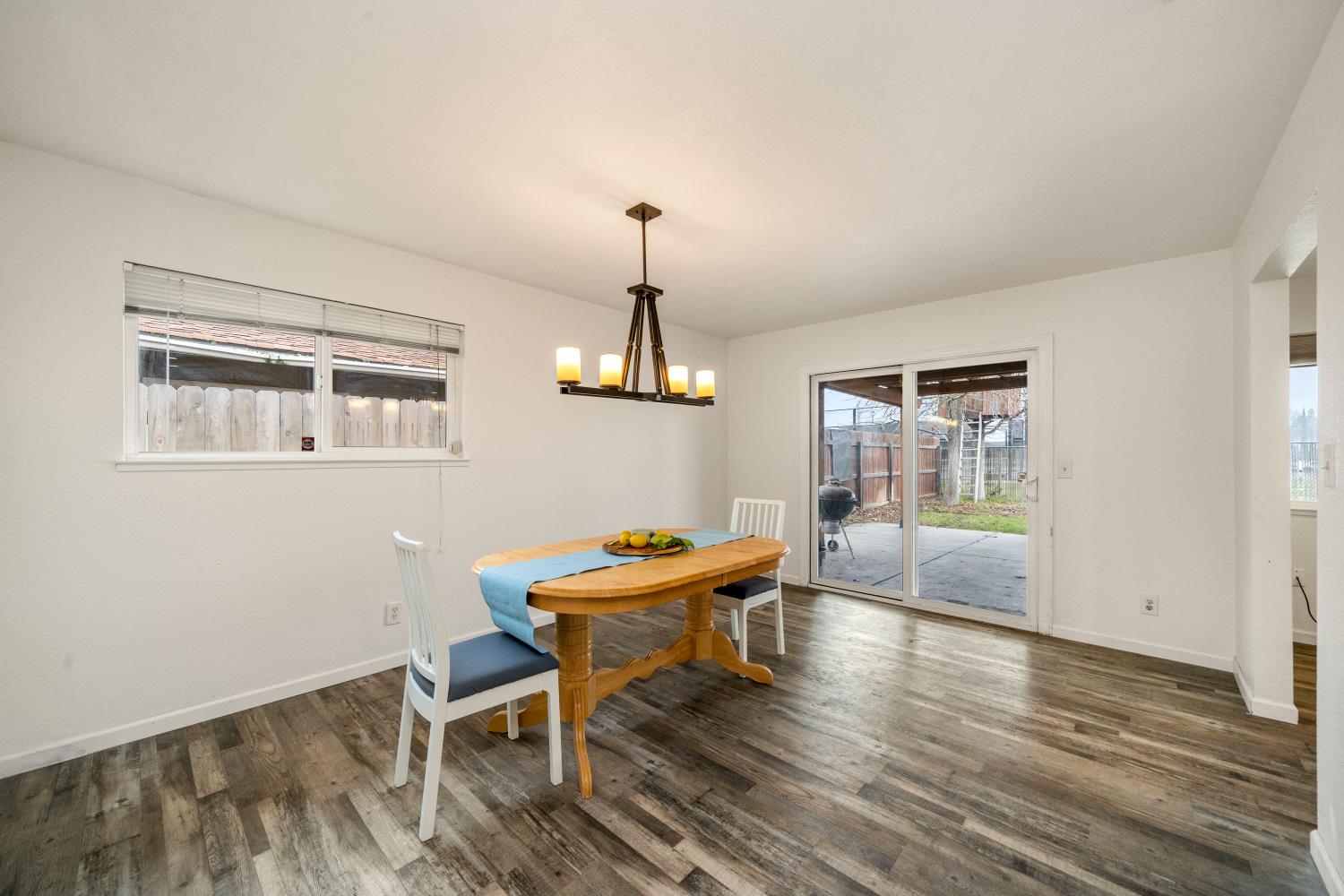 7358 Candlelight Way Citrus Heights, CA 95621 - Photo 19 of 45 a dining room with a wooden table and chairs