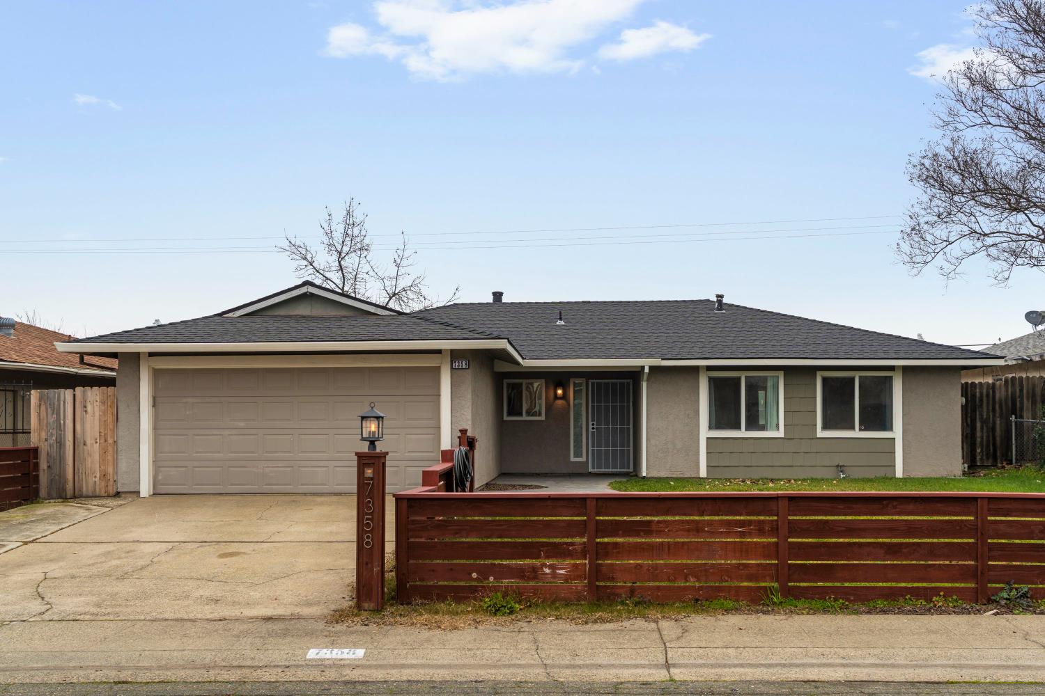 7358 Candlelight Way Citrus Heights, CA 95621 - Photo 2 of 45 a front view of a house with a garage