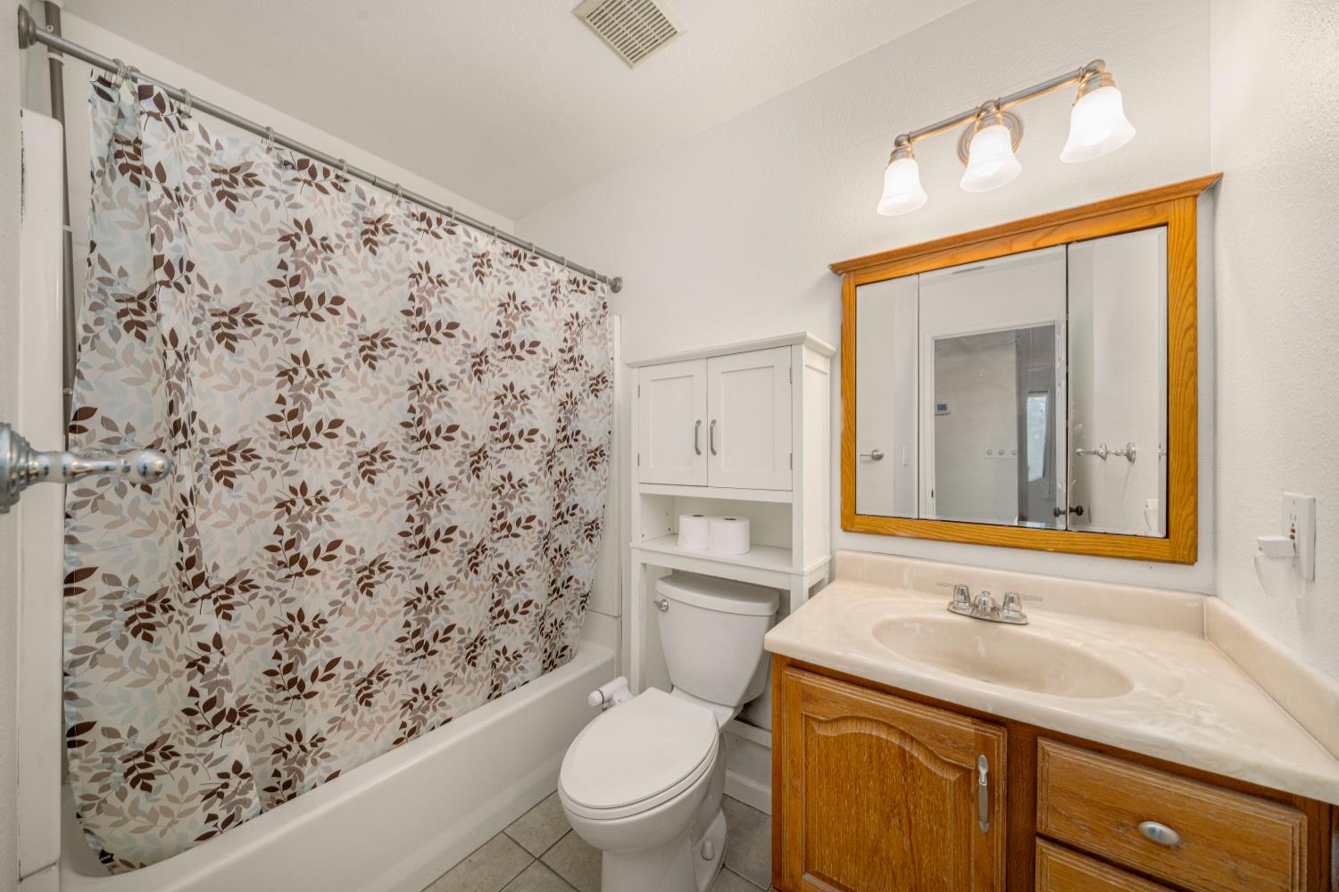 7358 Candlelight Way Citrus Heights, CA 95621 - Photo 22 of 45 a bathroom with a toilet sink and mirror