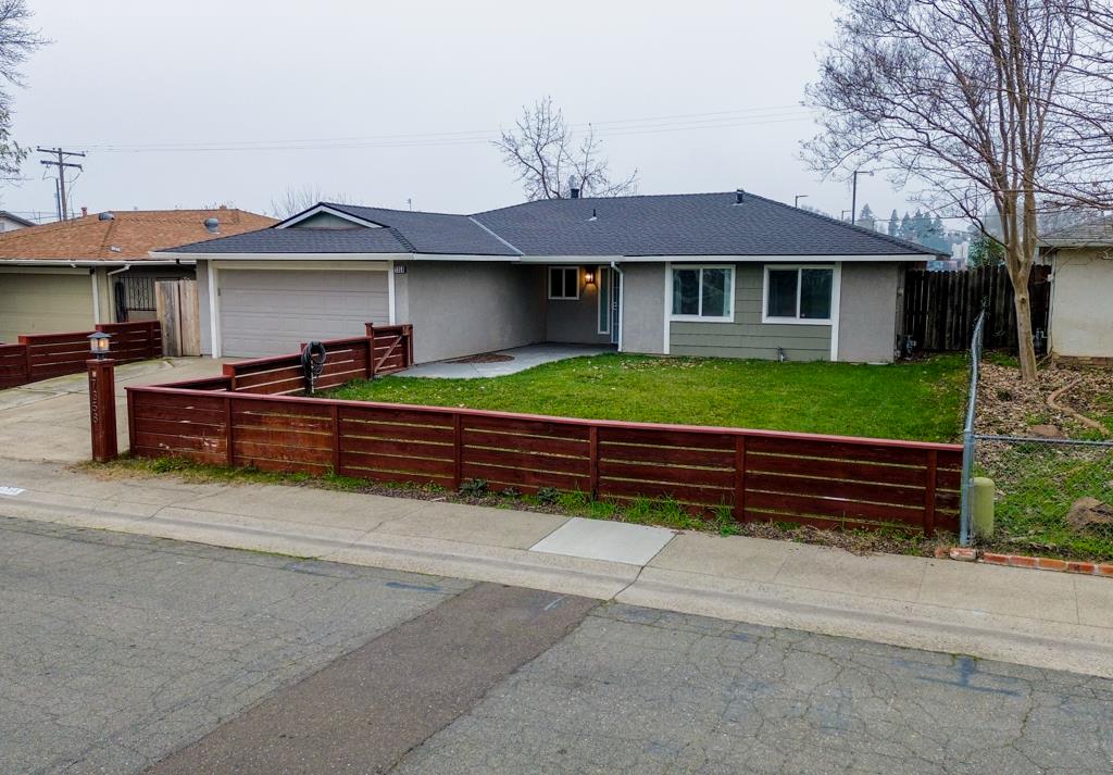 7358 Candlelight Way Citrus Heights, CA 95621 - Photo 3 of 45 a front view of a house with a yard