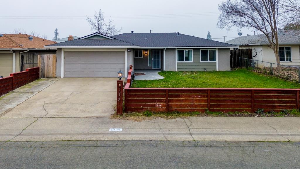 7358 Candlelight Way Citrus Heights, CA 95621 - Photo 45 of 45 a front view of a house with a yard