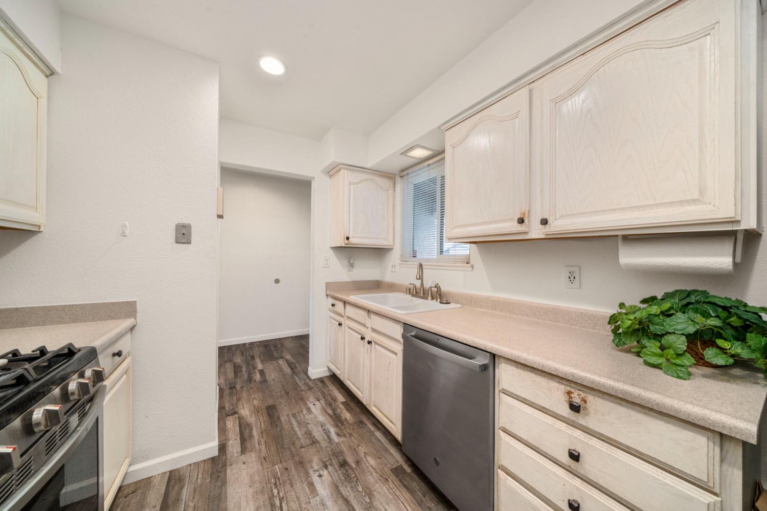 7358 Candlelight Way Citrus Heights, CA 95621 - Photo 9 of 45 a kitchen with stainless steel appliances granite countertop a sink and cabinets