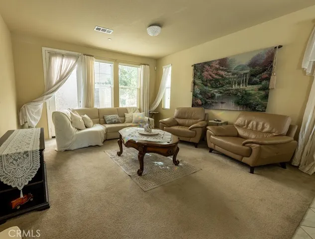 a living room with furniture and a couch