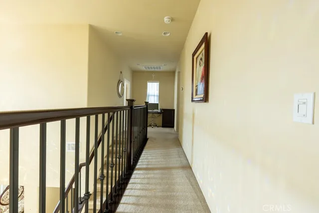 a bed sitting in a room next to a window