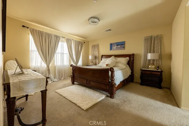 a spacious bathroom with a double vanity sink bathtub and next to a window