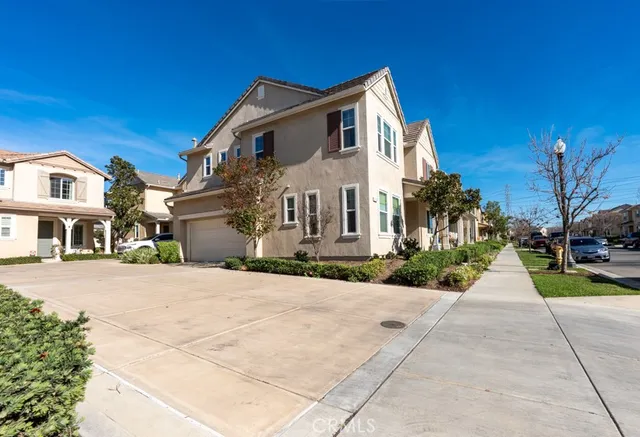 a view of a white apartments with large windows