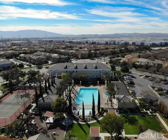 a view of a street with a yard and palm trees