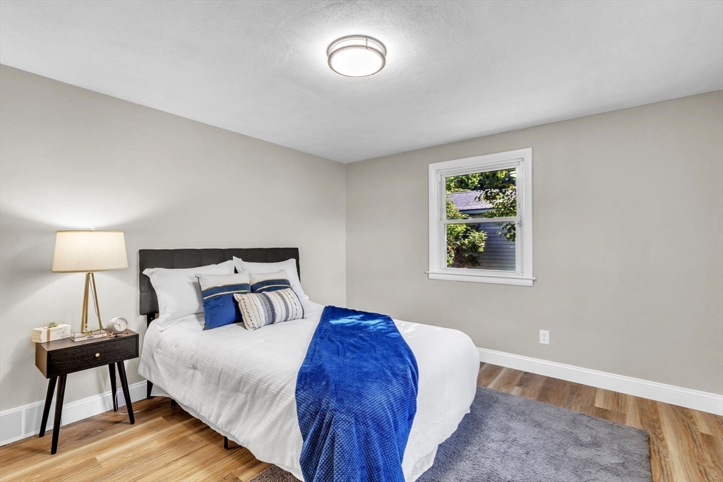 24 Capitol Road Springfield, MA 01119 - Photo 15 of 30 a bedroom with a bed and a lamp