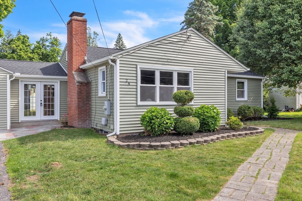24 Capitol Road Springfield, MA 01119 - Photo 3 of 30 a front view of a house with garden