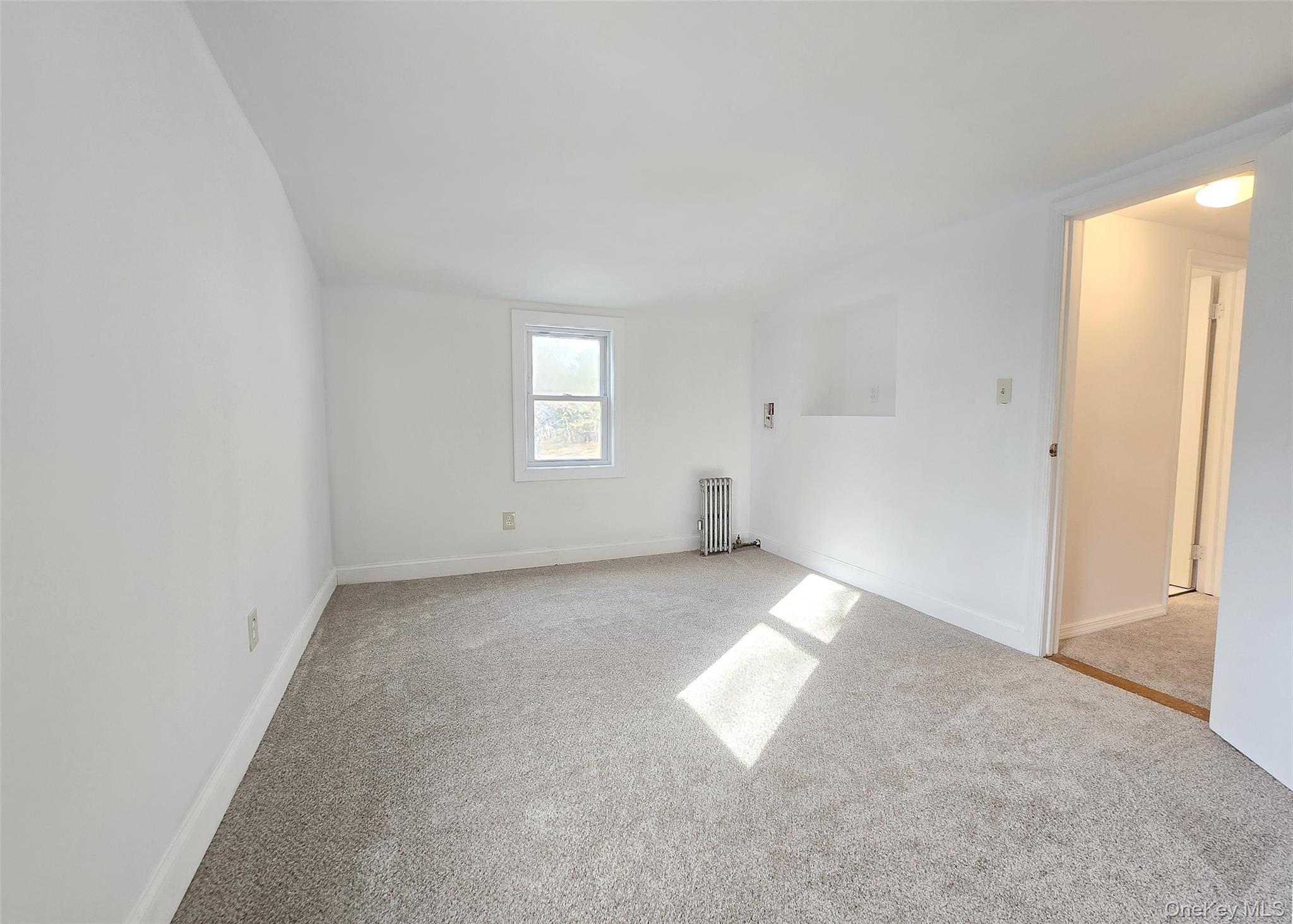 585 Pulaski Road Kings Park, NY 11754 - Photo 19 of 28 an empty room with windows