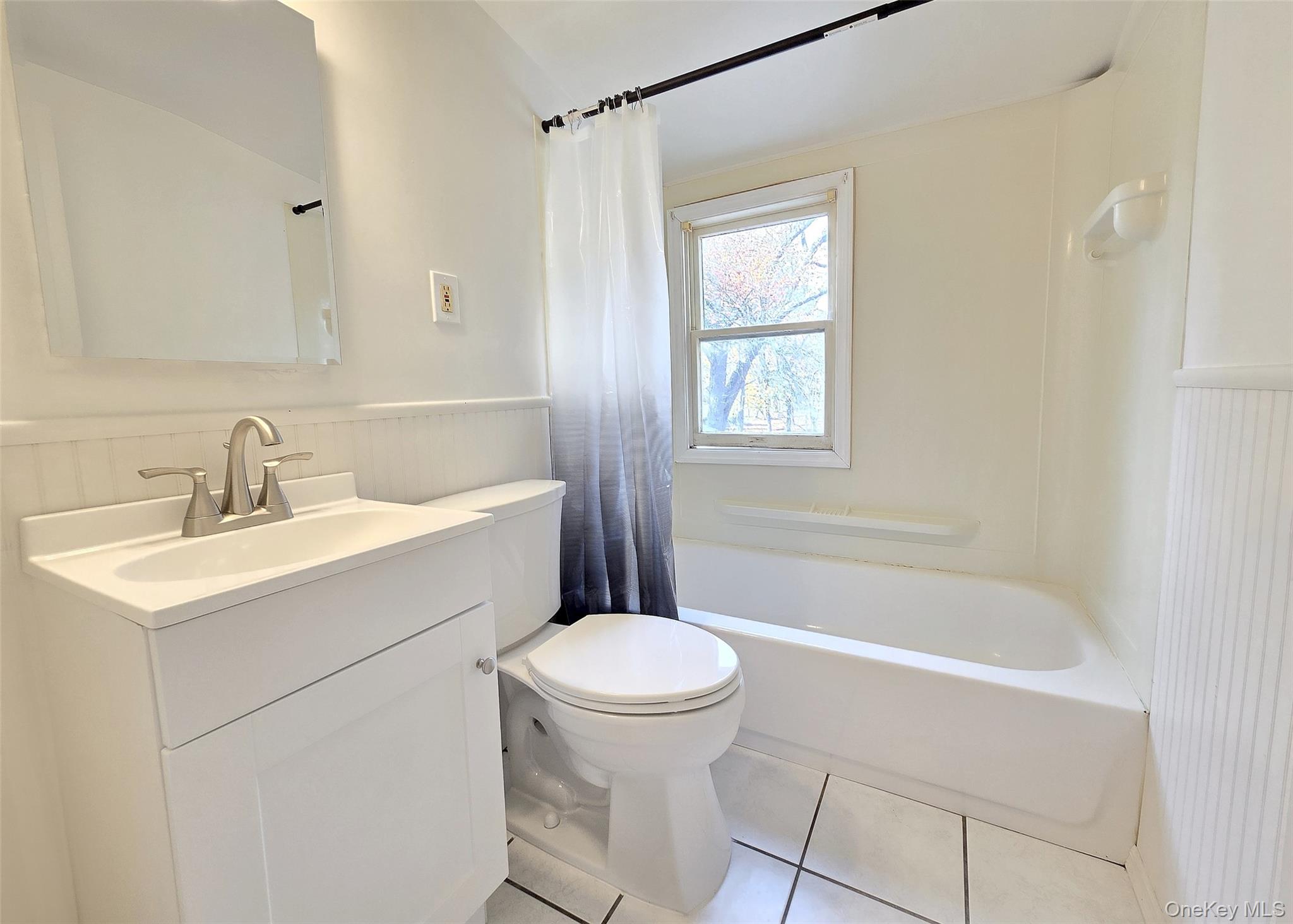 585 Pulaski Road Kings Park, NY 11754 - Photo 22 of 28 a bathroom with a sink toilet and shower