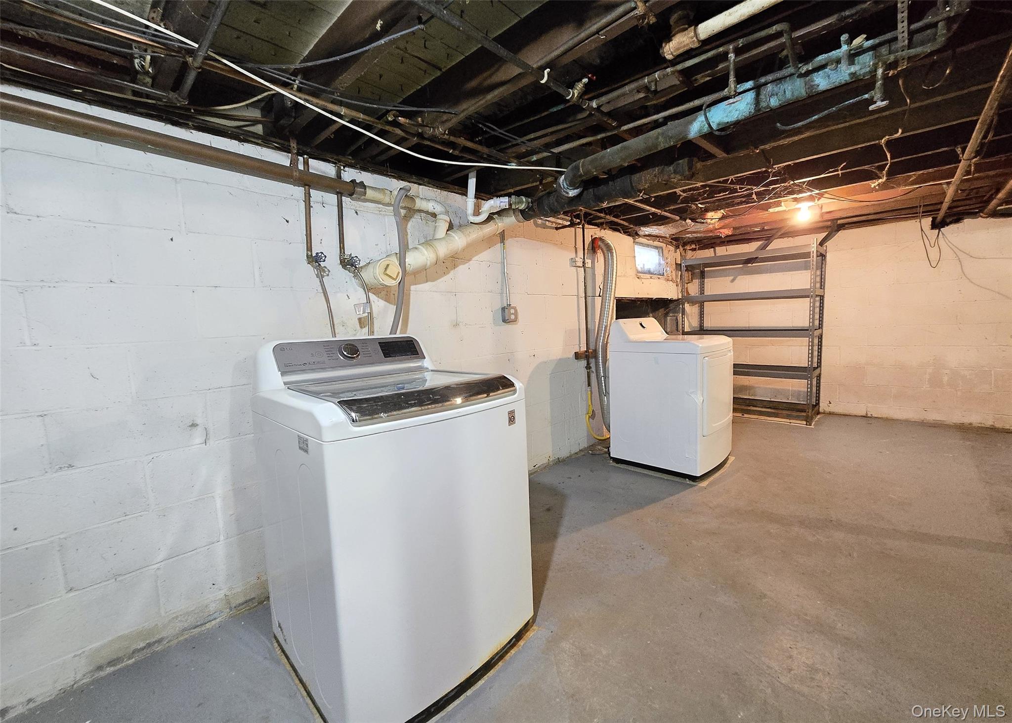 585 Pulaski Road Kings Park, NY 11754 - Photo 24 of 28 a utility room with dryer and washer