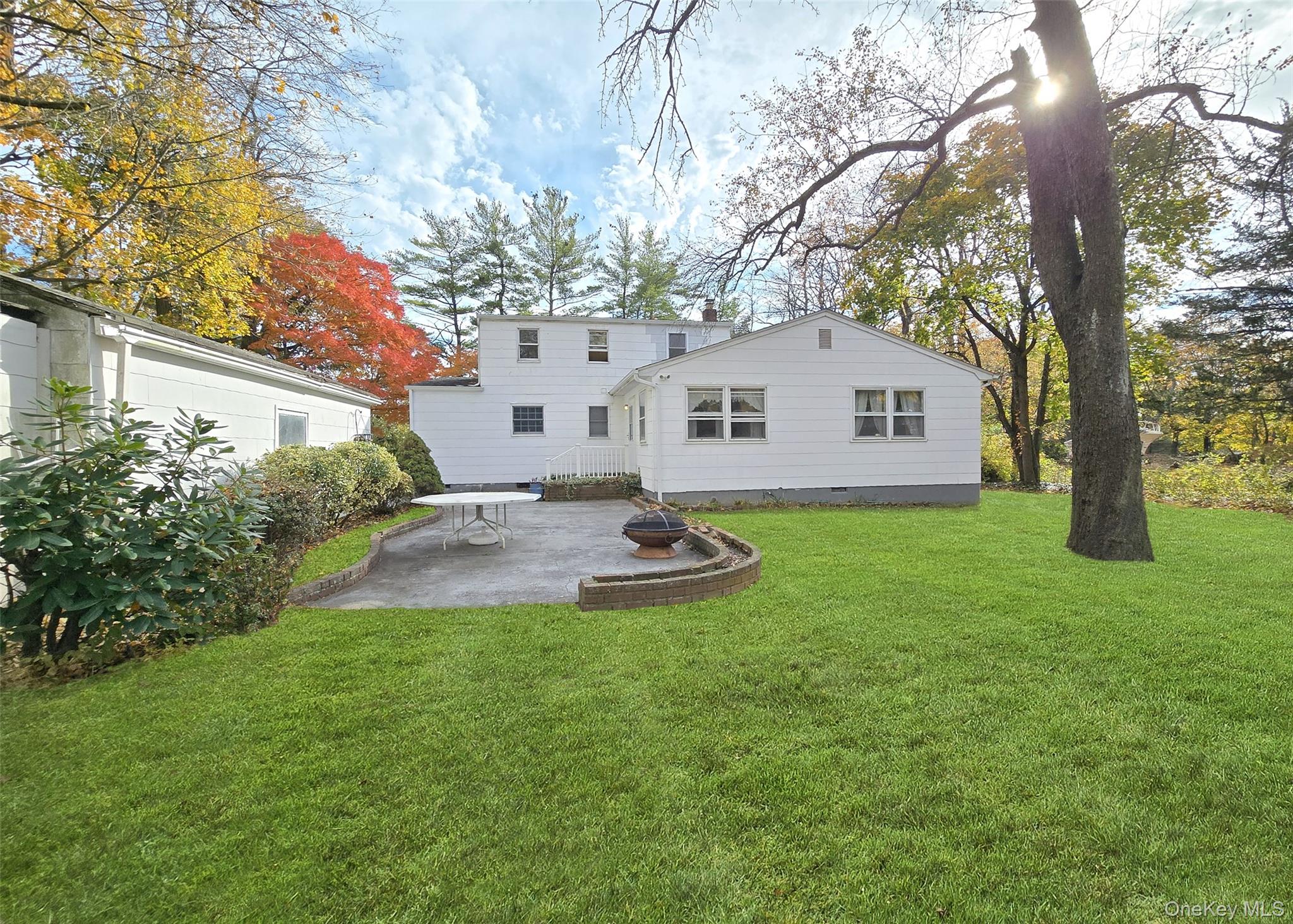 585 Pulaski Road Kings Park, NY 11754 - Photo 6 of 28 a view of a house with a backyard