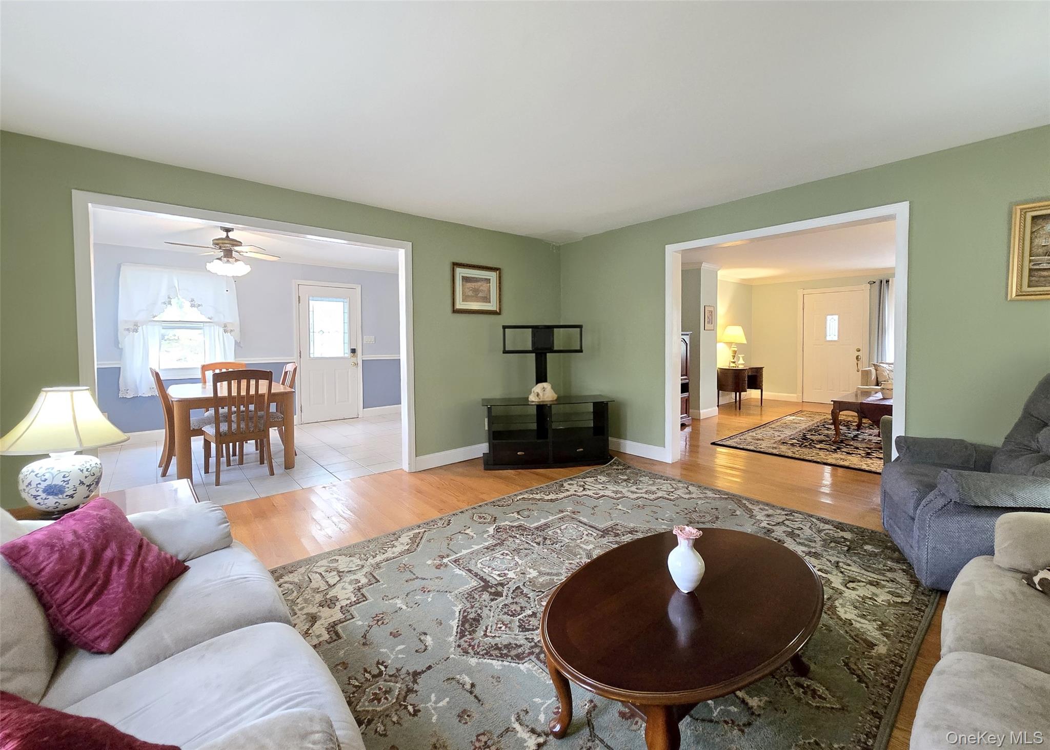 585 Pulaski Road Kings Park, NY 11754 - Photo 10 of 28 a living room with furniture and a wooden floor
